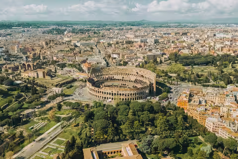 One-Day WOW Private Experience with Biking, Lunch, Golf Cart Tour, VIP Colosseum Access and Rooftop Aperitivo